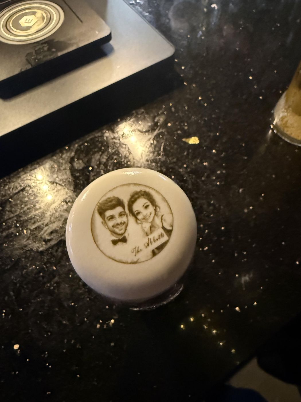 Illustrated couple portrait printed with edible ink on drink foam at a wedding